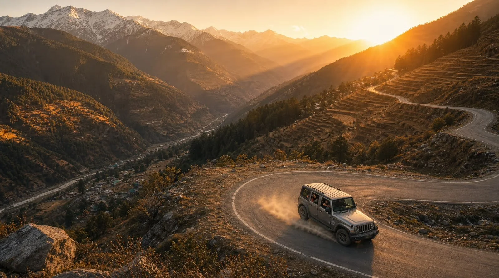 Frame 1 — The Descent Into Gold, drone shot of a 4x4 on a switchback mountain road at golden hour